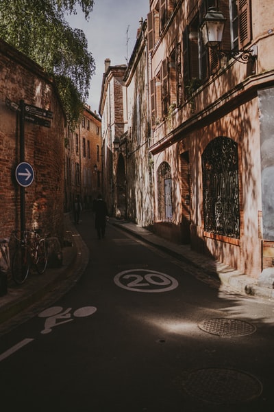 During the day, the empty car parked in the street
